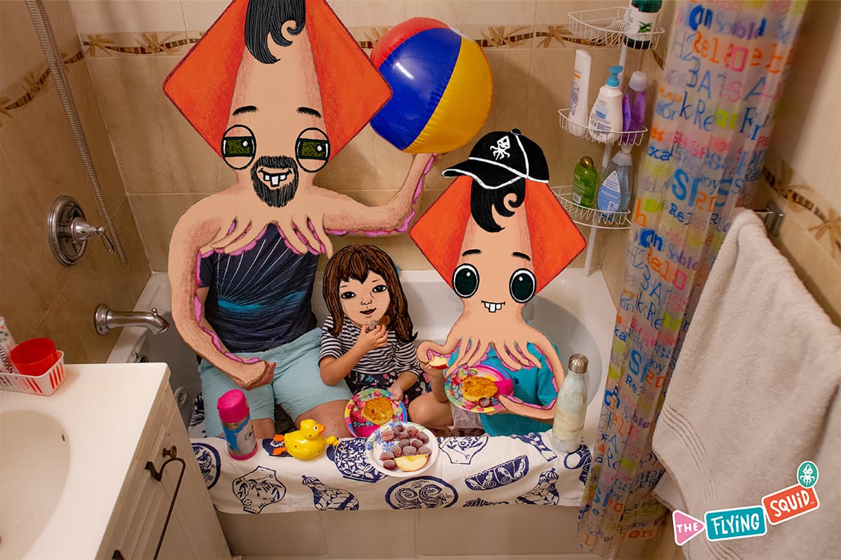 A father with his daughter and son, enjoy doing fun activities for kids. They are doing a picnic in a bathtub.